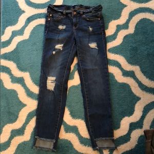 Dollhouse Step Hem Distressed Skinny Jeans